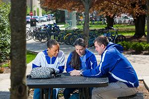 Three students at a table